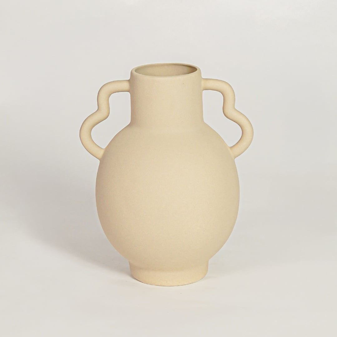 Minimalist beige ceramic flower vase with sculpted handles ideal for entryway table living room shelf or dining decor display.