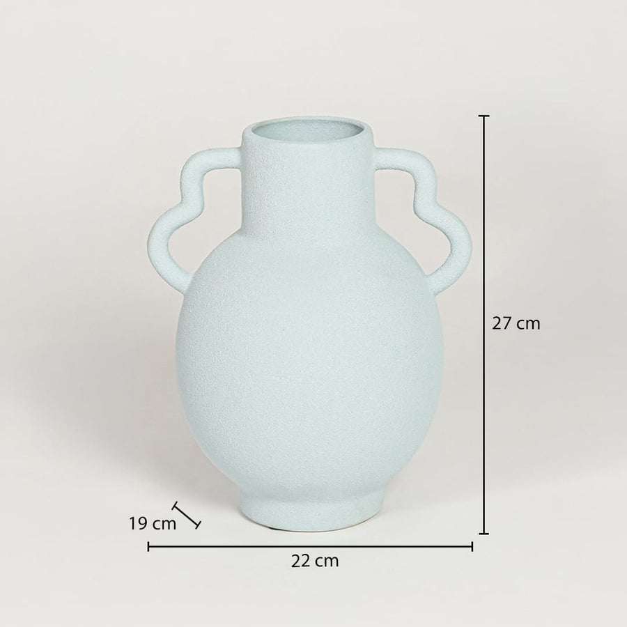 Slab blue ceramic double handle vase measuring 27 cm height 22 cm width and 19 cm depth ideal for modern decor placement.