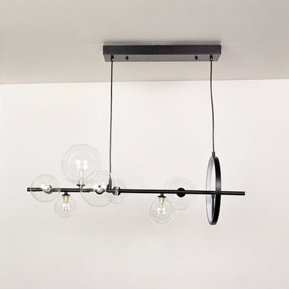 Linear pendant light switched off on white background showing clean structure glass globes and balanced proportions.