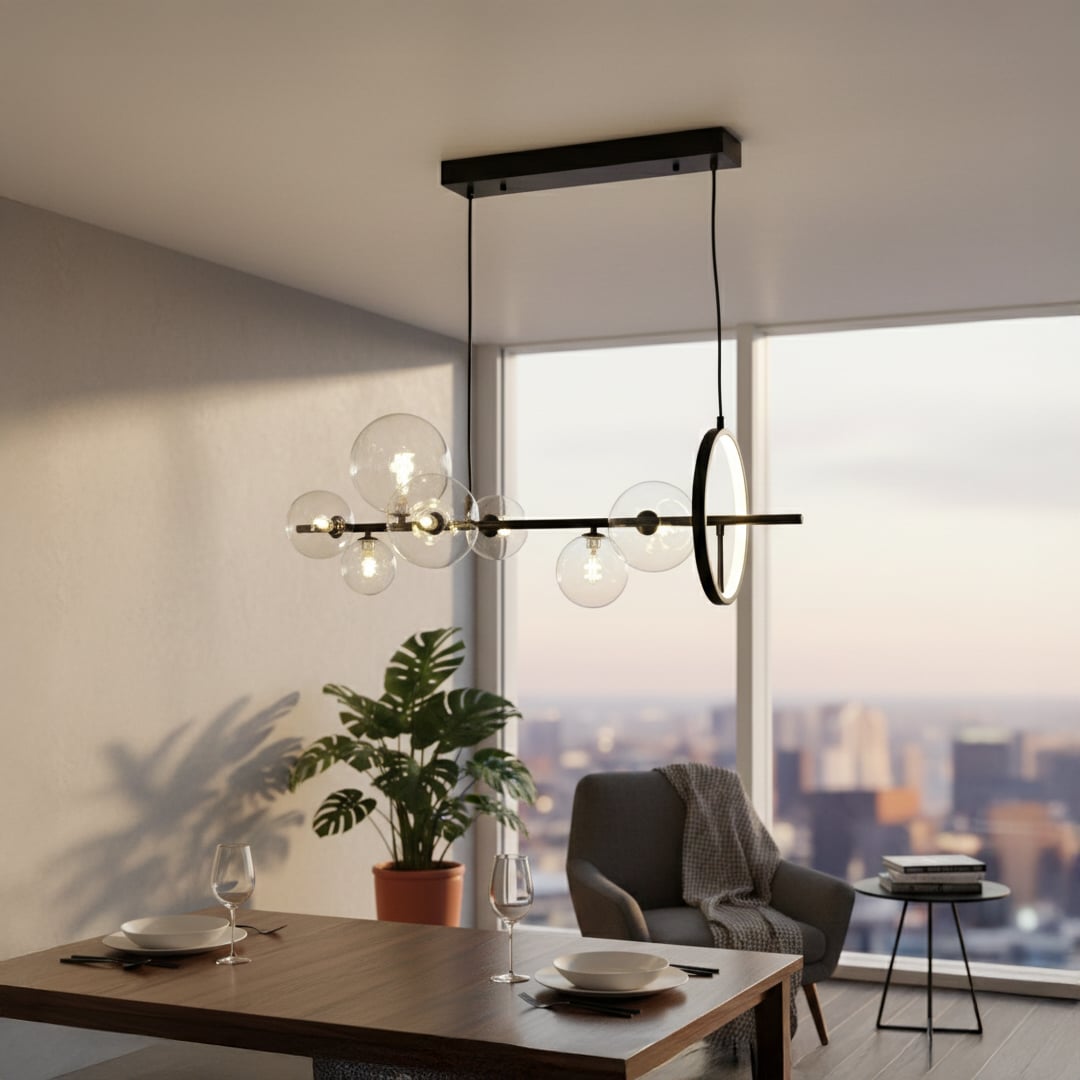 Modern linear pendant light with clear glass globes suspended from black ceiling mount styled in minimal interior setting.