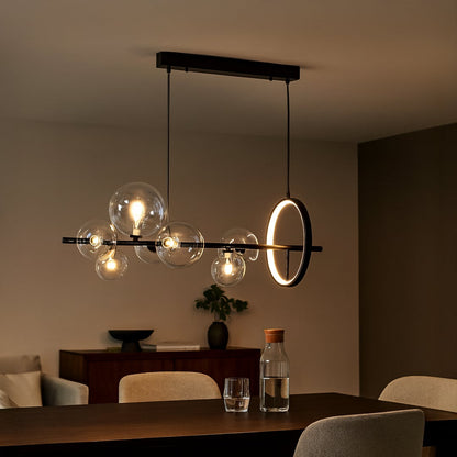 Contemporary hanging pendant light styled in modern space emphasizing horizontal form and elegant glass globes.