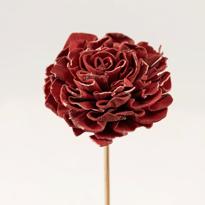 Closeup view of red sola flower head with layered petals creating a realistic artificial flower for elegant vase decoration.