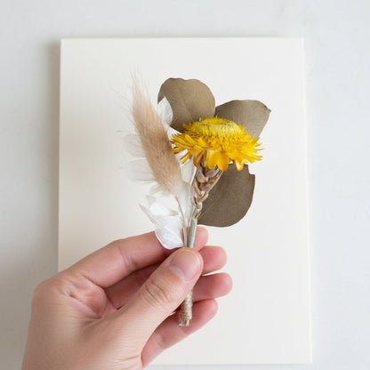 Dried flower bouquet with yellow billy buttons natural wheat and soft neutral tones ideal for minimalist home Decor styling.