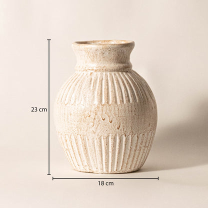 Ribbed vase measuring 23 cm in height and 18 cm in width - ideal for styling with fresh or dried flowers.