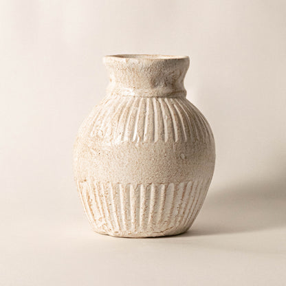 Elegant ceramic vase in off white finish with detailed texture for table decor or shelf styling contemporary home placement white background.