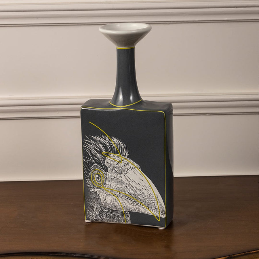 Black ceramic bottle vase closeup showing hand painted bird motif and glossy finish for elegant statement home decor piece.