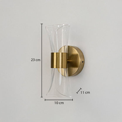Gold wall light with sculpted clear glass shade shown with 23 cm height and 10 cm width for accurate sizing.
