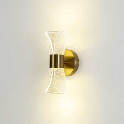 Minimal wall light in gold metal finish with sculpted glass design for bedroom or living decor lighting placement white background.