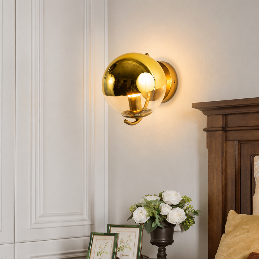 Lifestyle image of gold space ball metal wall lamp for elegant hallway decor styling and modern home interior lighting.