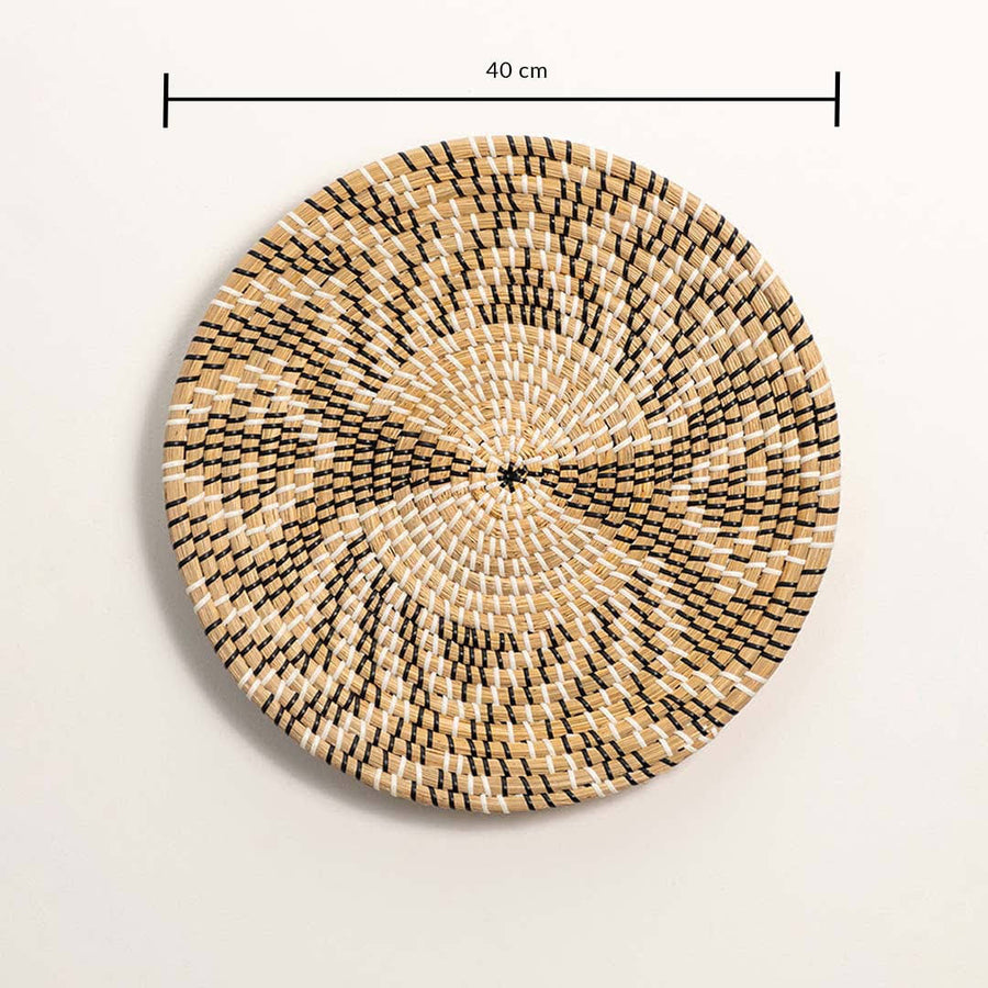 Dimension image of handcrafted black natural seagrass wall basket with abstract geometric radial pattern for boho wall decor.