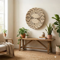 Natural woven wall basket displayed above a console table for elegant bohemian wall decor and cozy home interiors.