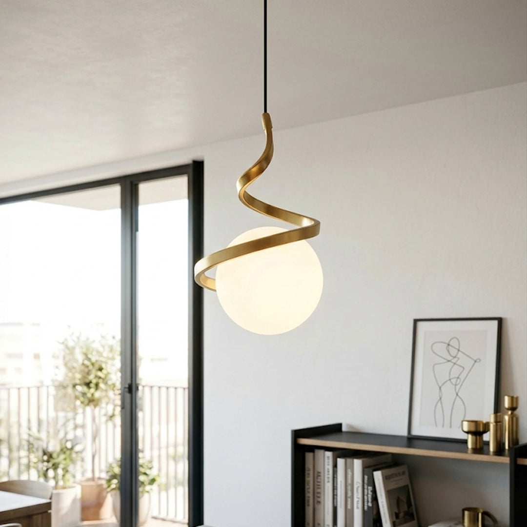 Gold metal spiral pendant light with white glass globe adding elegance to modern interiors.