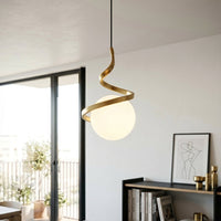 Gold metal spiral pendant light with white glass globe adding elegance to modern interiors.