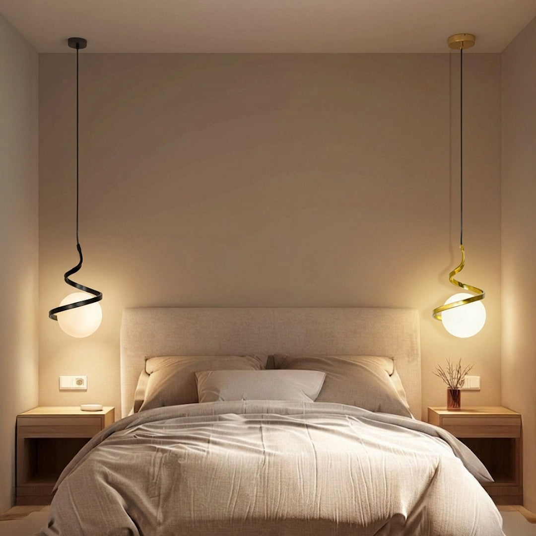 Black metal spiral pendant lights with white glass globes adding warm elegance to modern bedrooms.