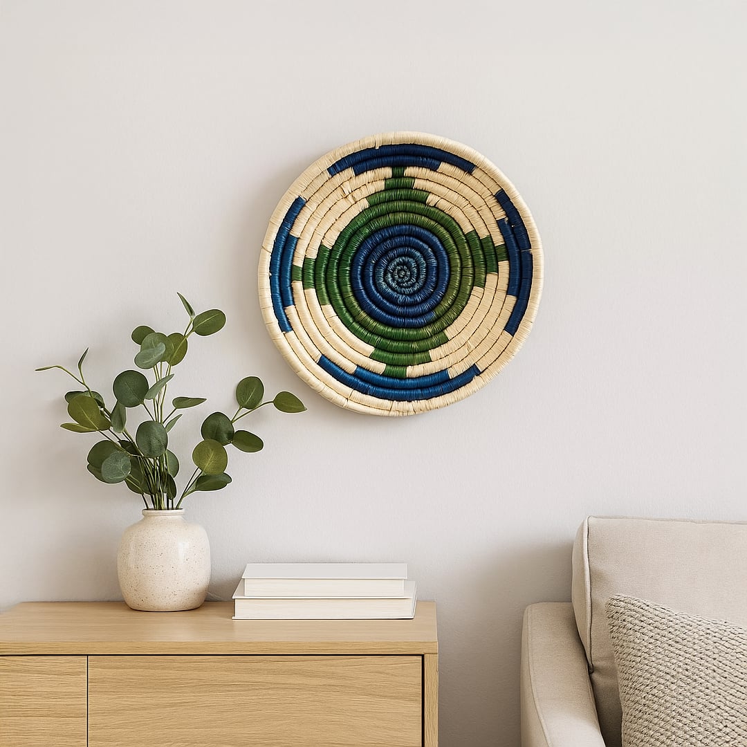 Decorative woven wall basket styled above console with plant and books adding natural warmth to modern interior Decor space.
