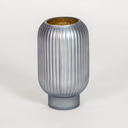 Modern grey ribbed glass vase for minimalist home decor and elegant shelf display accent in contemporary style.