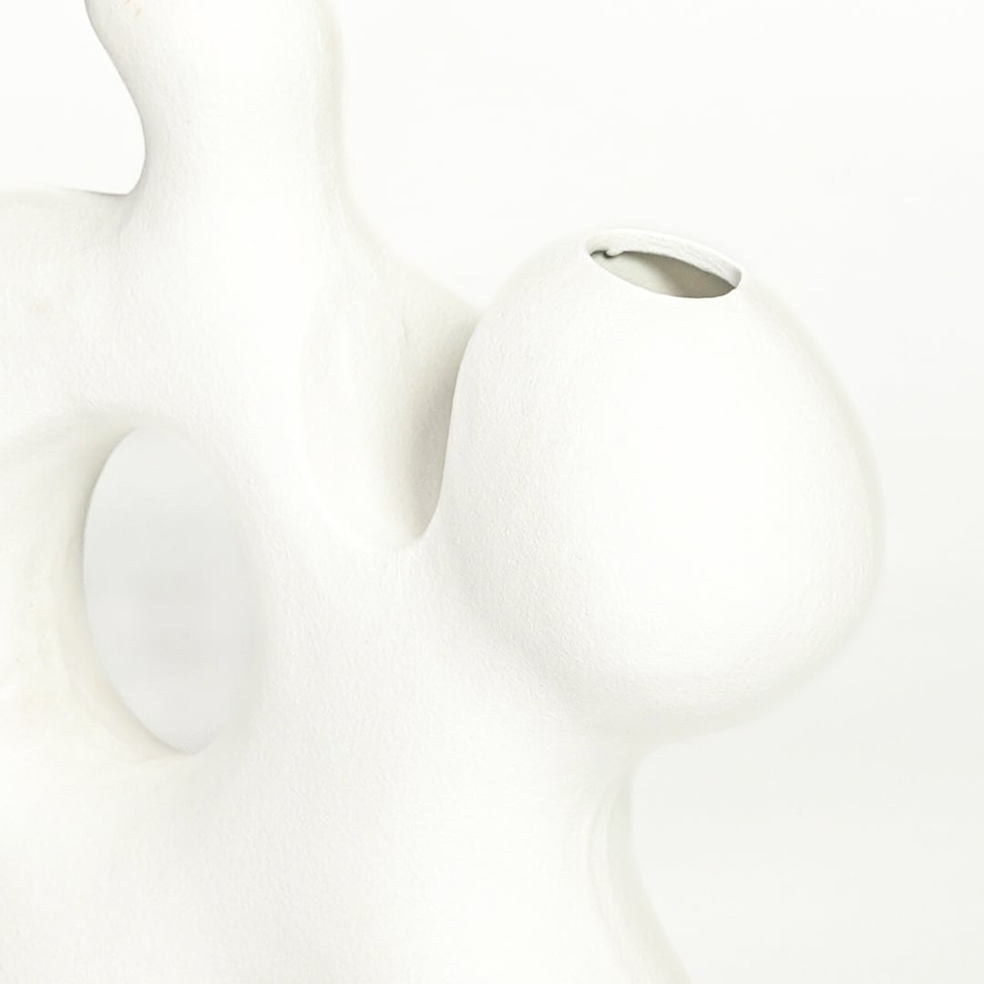 sporadic white ceramic vase closeup 1
