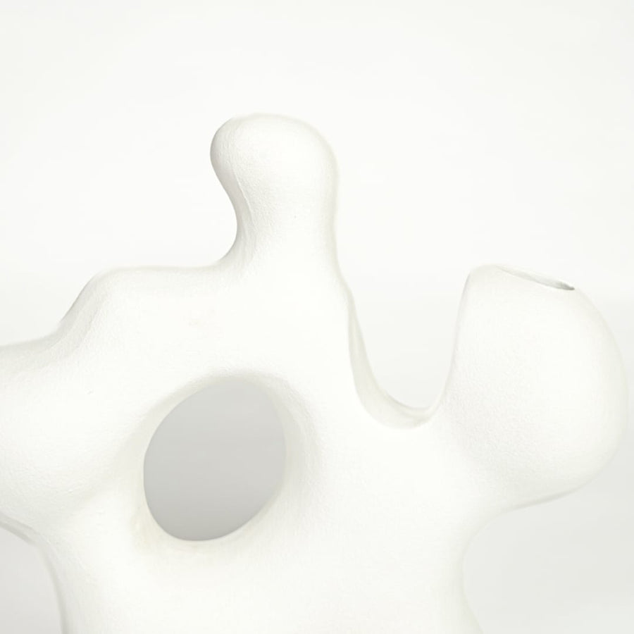 sporadic white ceramic vase closeup