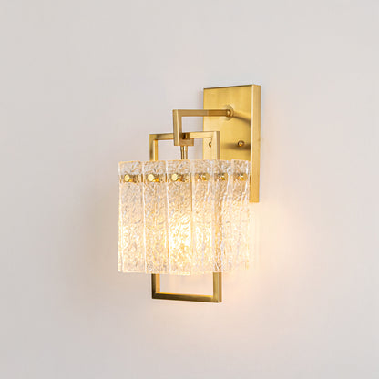 Decorative wall light with gold frame and textured crystal glass panels on neutral background elegant ambient lighting for living room bedroom decor.
