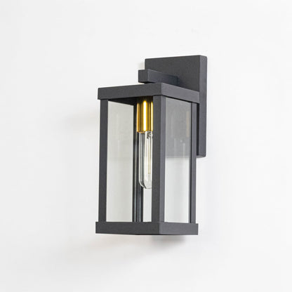 Black metal exterior wall light switched off on white background emphasizing minimal design and sturdy metal construction.