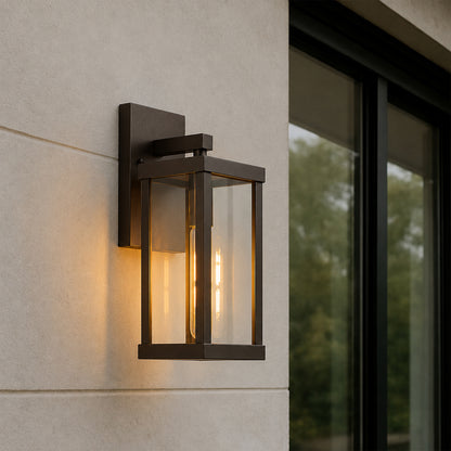 Black metal outdoor wall light lifestyle image with warm glow for modern exterior entryway lighting decor.