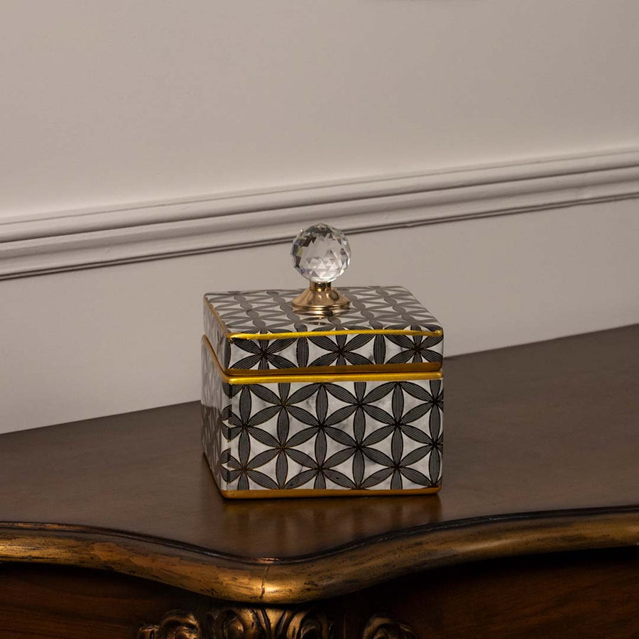 Square ceramic jar with black geometric flower pattern and crystal knob lid perfect for elegant home styling.