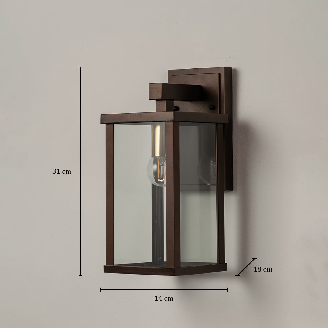 Metal wall lantern measuring 31 cm height 14 cm width and 18 cm depth shown with clear glass panels for outdoor lighting.