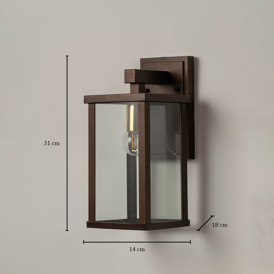 Metal wall lantern measuring 31 cm height 14 cm width and 18 cm depth shown with clear glass panels for outdoor lighting.