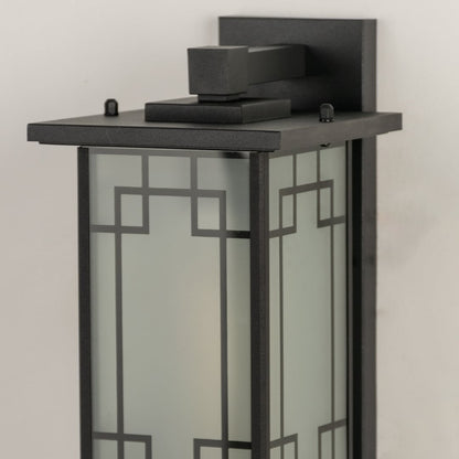 Closeup of gold outdoor lantern showing decorative glass detailing and textured metal frame ideal for classic outdoor porch patio and entryway lighting.