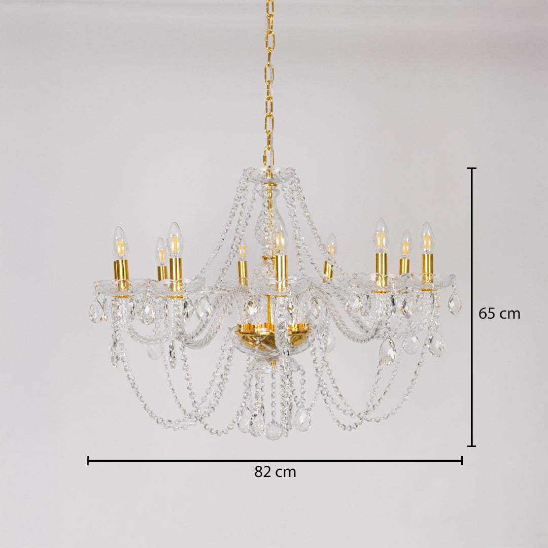 Chandelier with crystal and gold design shown with 82 cm width and 65 cm height for decorative lighting.