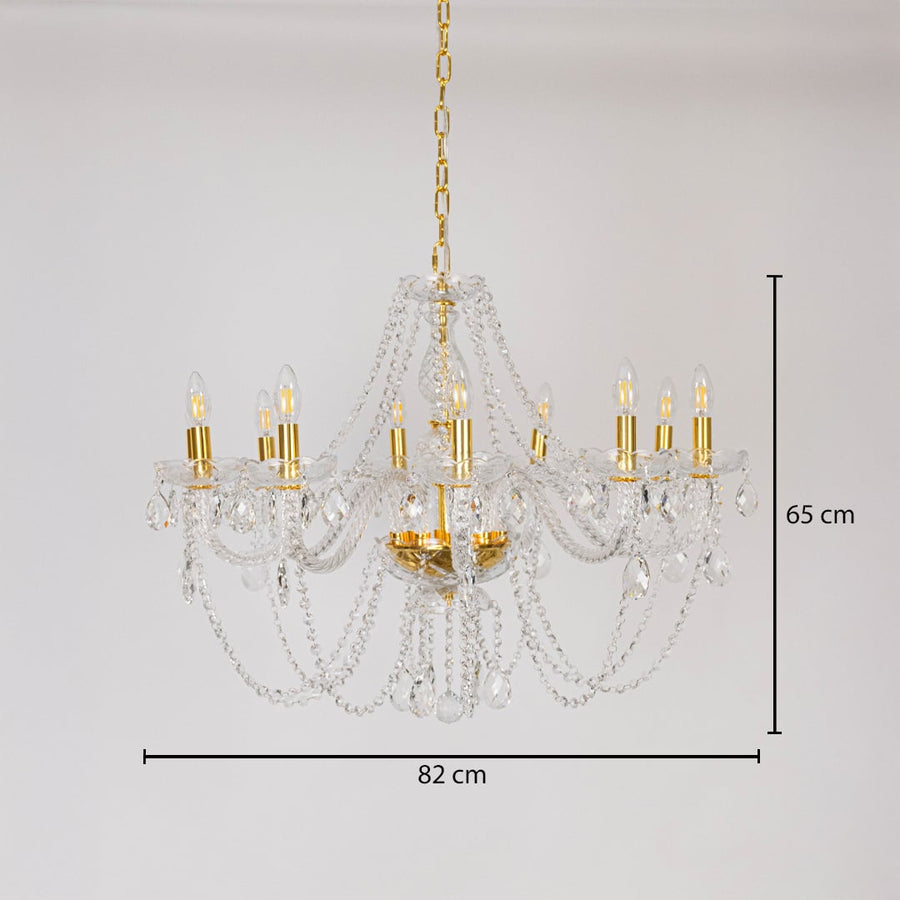 Chandelier with crystal and gold design shown with 82 cm width and 65 cm height for decorative lighting.