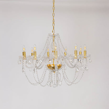 Classic chandelier with crystal and gold finish shown off on white background for modern home decoration.