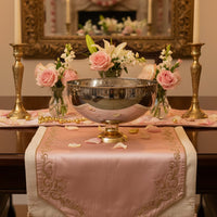 Gold metal decorative bowl lifestyle image with floral arrangement for elegant classic dining table decor.