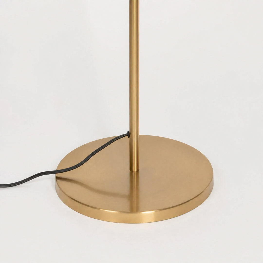 Closeup image of linear gold metal floor lamp base for elegant living room decor styling and modern home lighting design.