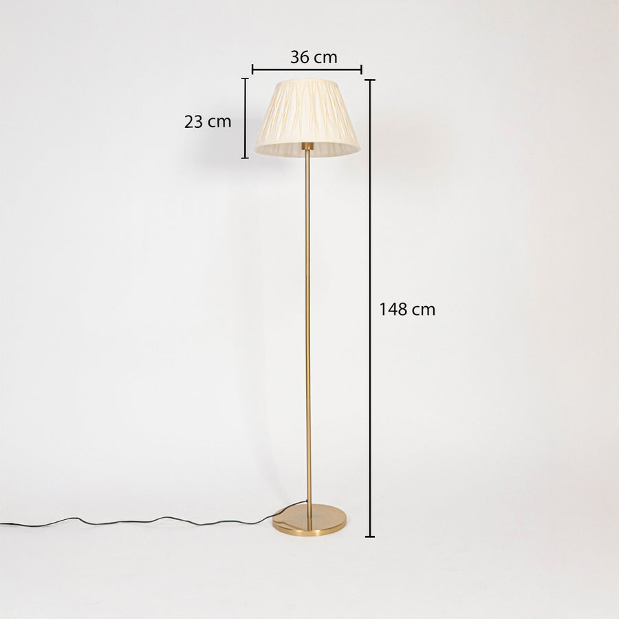 Floor lamp dimensions image showing 148 cm height with 36 cm wide and 23 cm tall white pleated shade on golden stand.