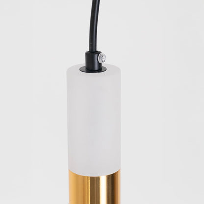 Closeup of luxury black and gold cylindrical pendant light showing fine detailing and premium craftsmanship design.