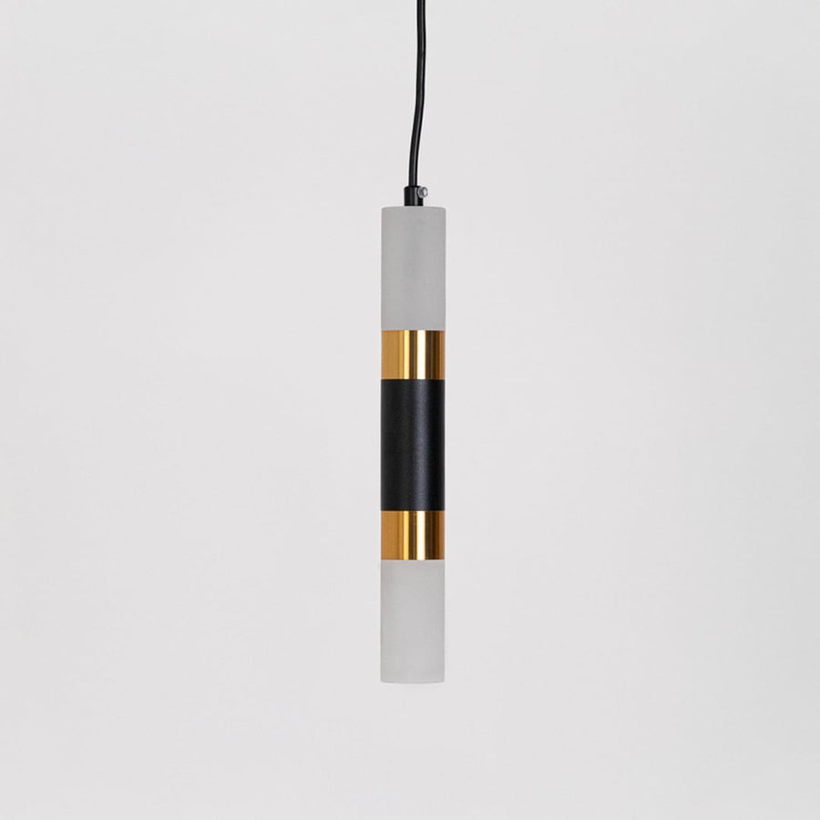 Minimalist black and gold cylindrical pendant light turned off displayed against white background for catalog product view.