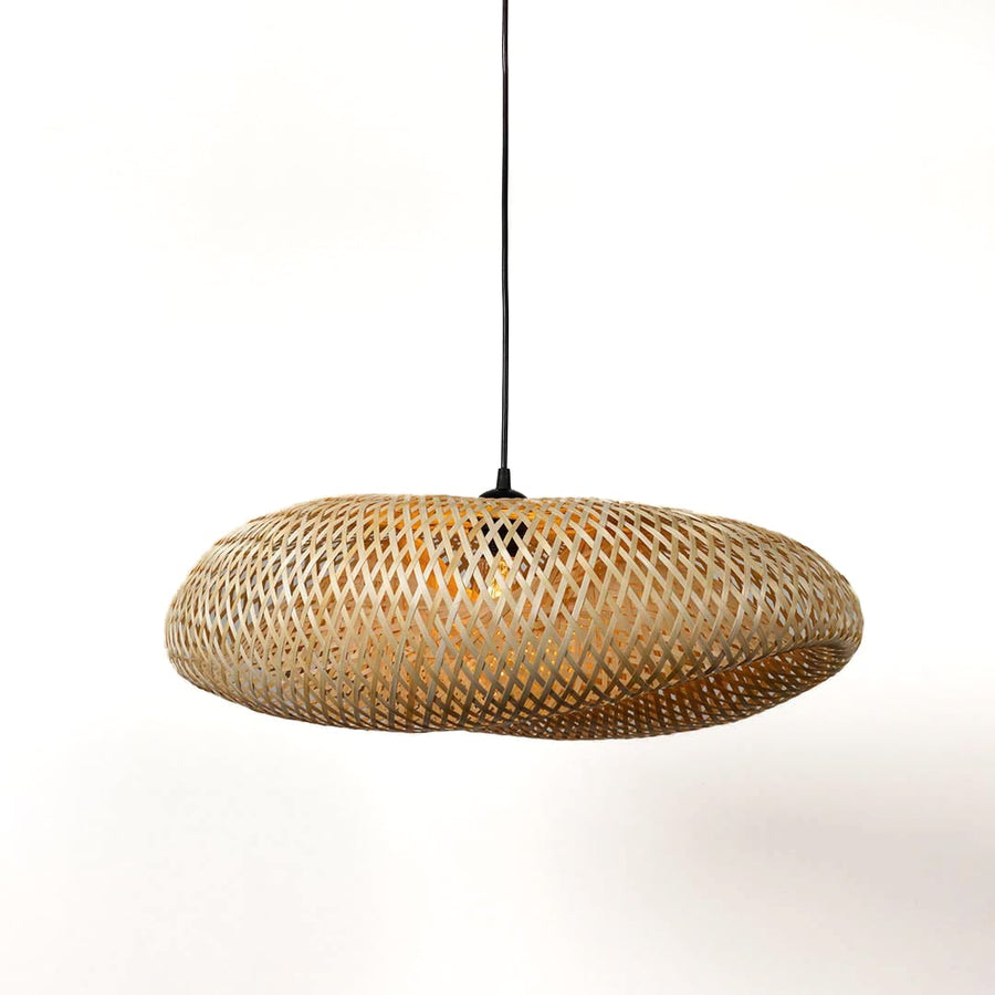 Flat woven rattan pendant light with natural beige finish displayed on white background for boho interiors.