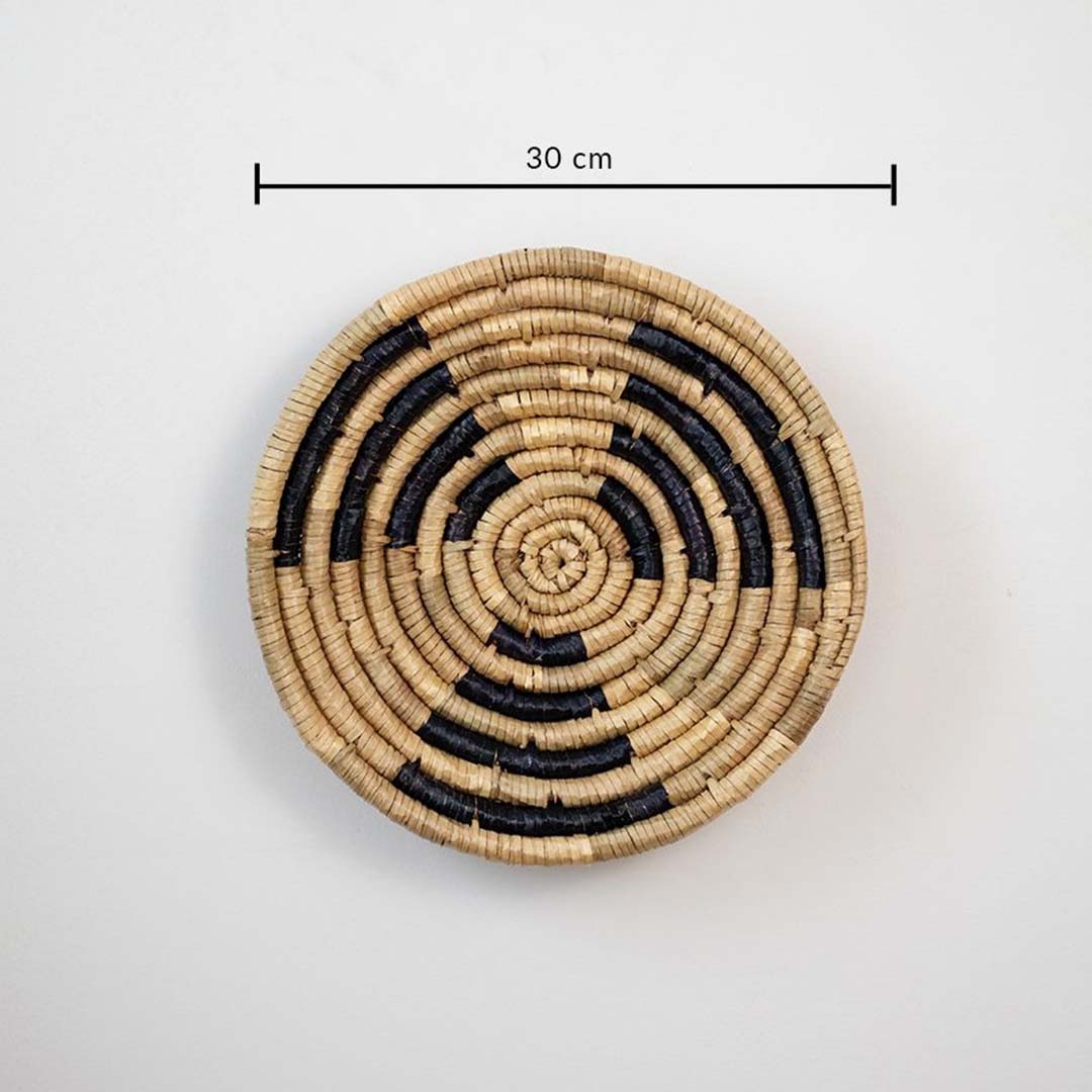 Handwoven wicker wall plate in brown with black weaving 30 cm size dimension image for living room dining wall decoration.