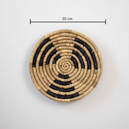 Handwoven wicker wall plate in brown with black weaving 30 cm size dimension image for living room dining wall decoration.