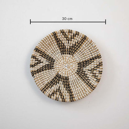 Handwoven wicker wall plate in brown with white and black weaving 30 cm size dimension image for living room wall decoration.