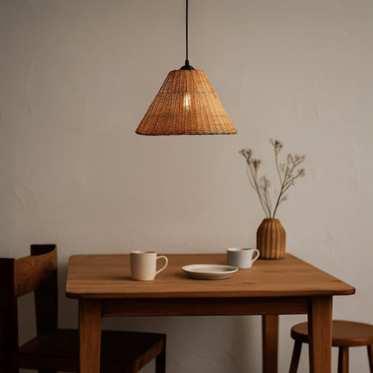 Woven rattan pendant light adding natural warmth and organic texture to cozy modern living and dining spaces.