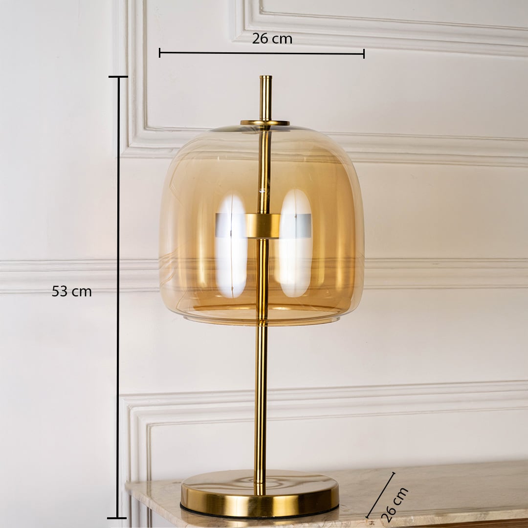 Gold metal table lamp with amber glass shade shown with 53 cm height and 26 cm width for accurate placement.