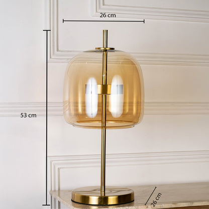 Gold metal table lamp with amber glass shade shown with 53 cm height and 26 cm width for accurate placement.