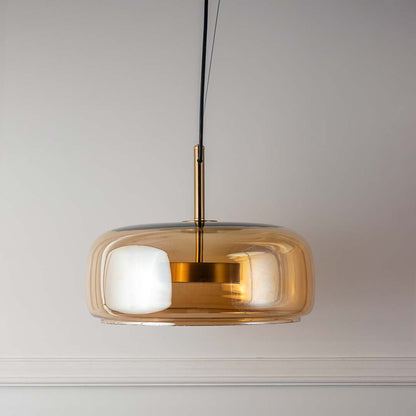 Amber glass pendant light with white diffuser and gold finish modern hanging lamp for kitchen dining decor lighting.