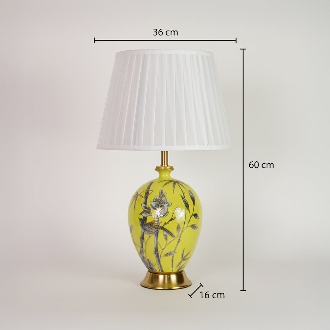 Yellow ceramic table lamp showing 60 cm height 36 cm shade width and 16 cm base size suitable for bedside placement.