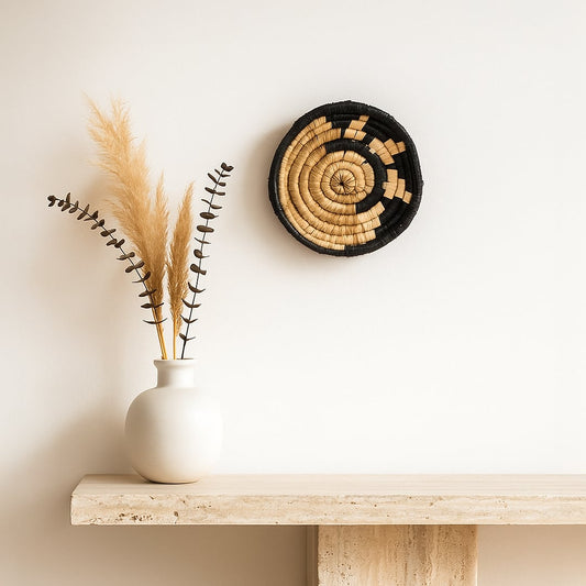 Matte ceramic vases paired with dried grass and round wall clock styled together to create balanced modern decor composition with natural earthy accents.