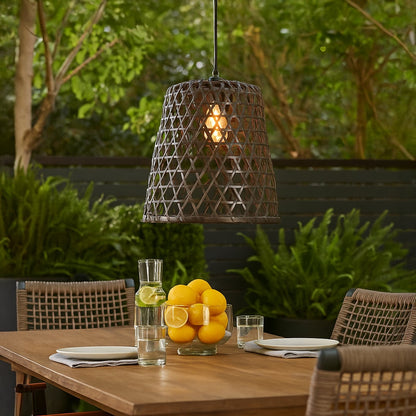 Woven black bamboo pendant light adding artistic texture and warm glow to contemporary home interior spaces.