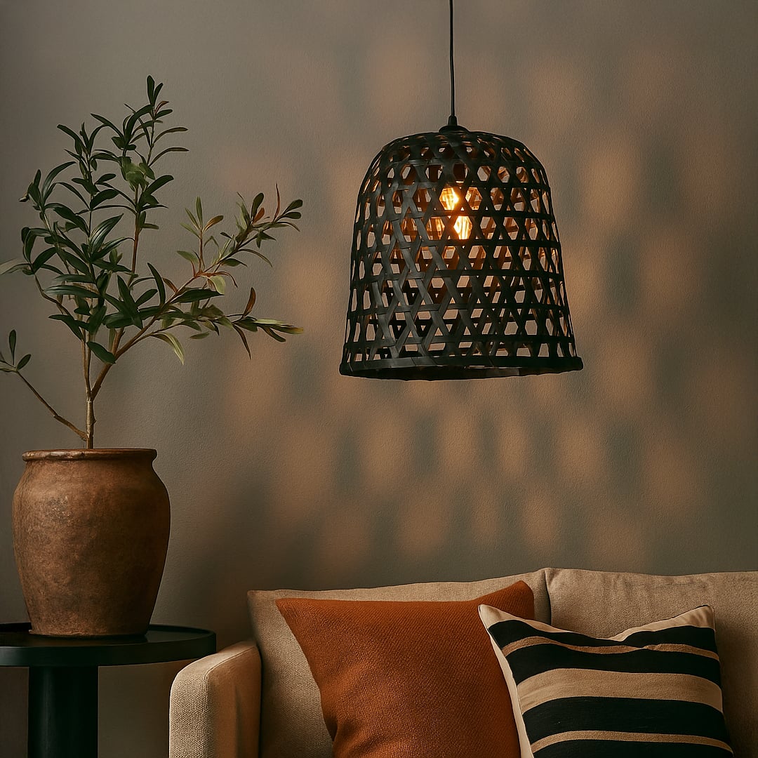 Woven black rattan pendant light creating a warm ambient glow and adding natural charm to modern living spaces.
