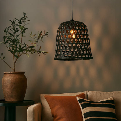 Woven black rattan pendant light creating a warm ambient glow and adding natural charm to modern living spaces.